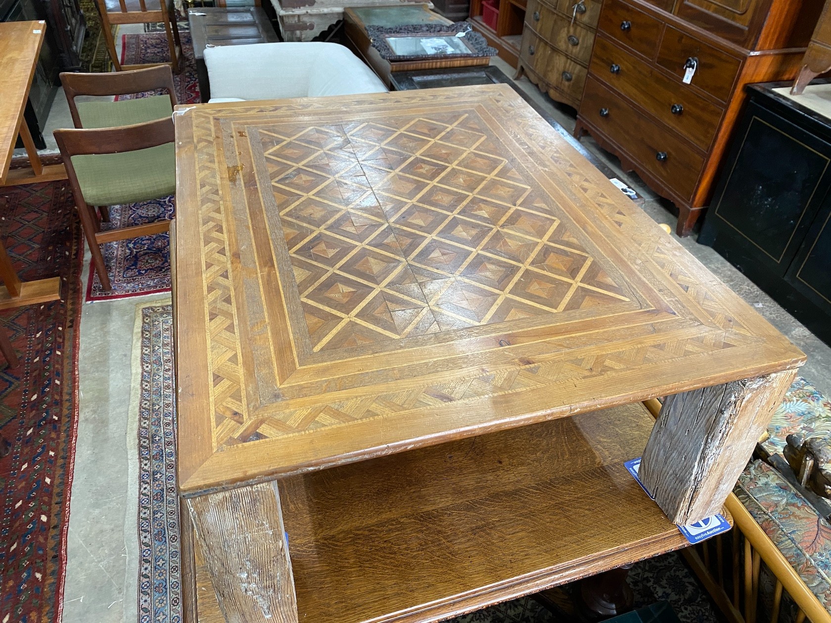 A rectangular parquetry coffee table, width 115cm, depth 89cm, height 40cm